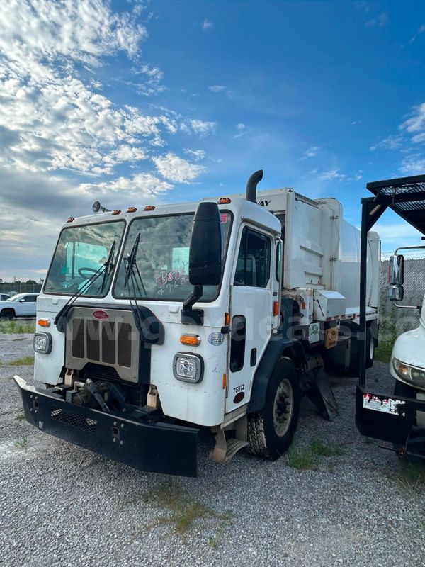 White 2019 Peterbilt 520 Side With New Way Loader Garbage Truck