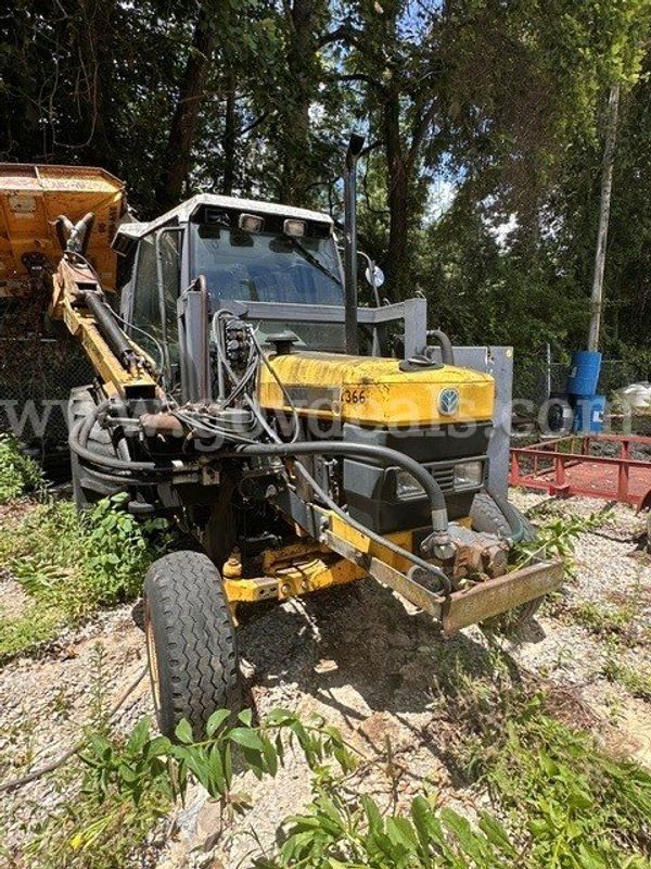 (1) USED 1997 NEW HOLLAND TRACTOR W/LONG ARM MOWER