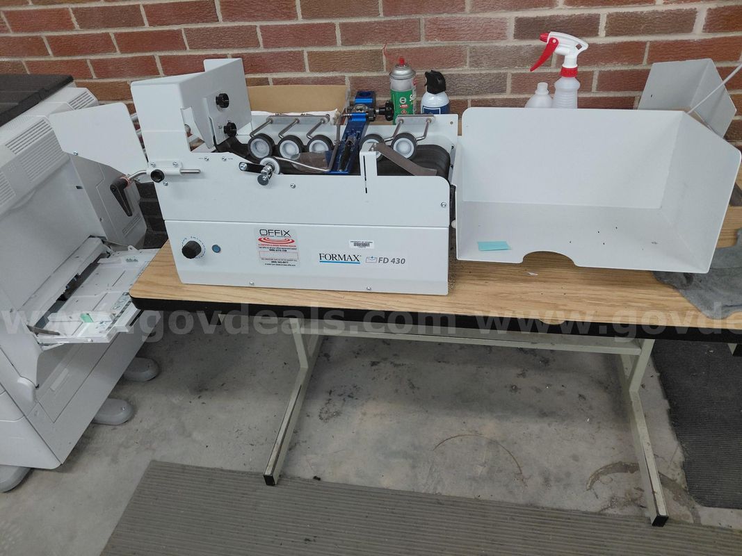 High-speed envelope sealing machine designed for mailrooms, businesses, and organizations handling large mailing volumes