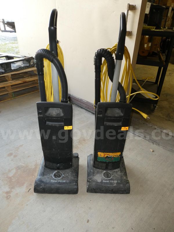 Two Upright Vacuum Cleaners