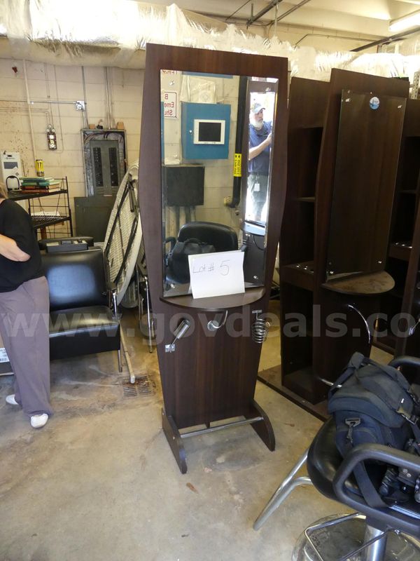 Single salon station with mirror and adjustable barber chair. SOLD-AS-IS