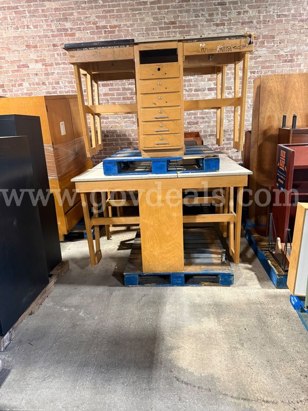 Five Wooden seven drawer work desk.
