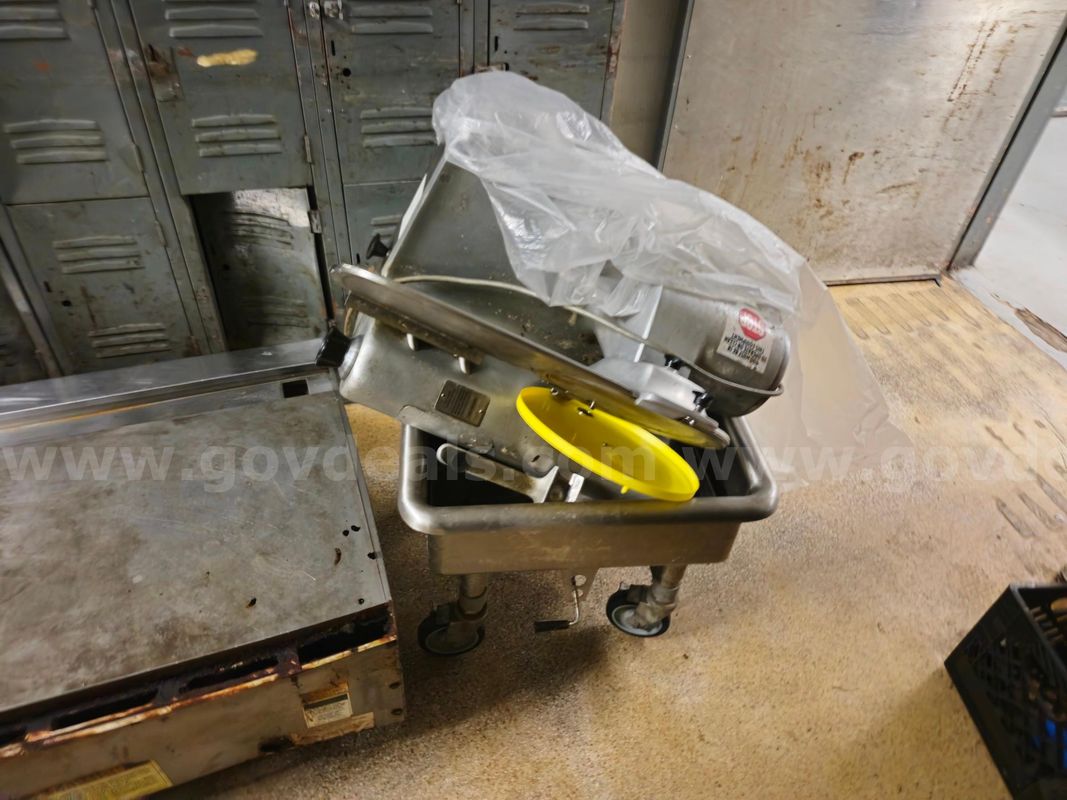 (2) Hobart Meat Slicers and metal bin included