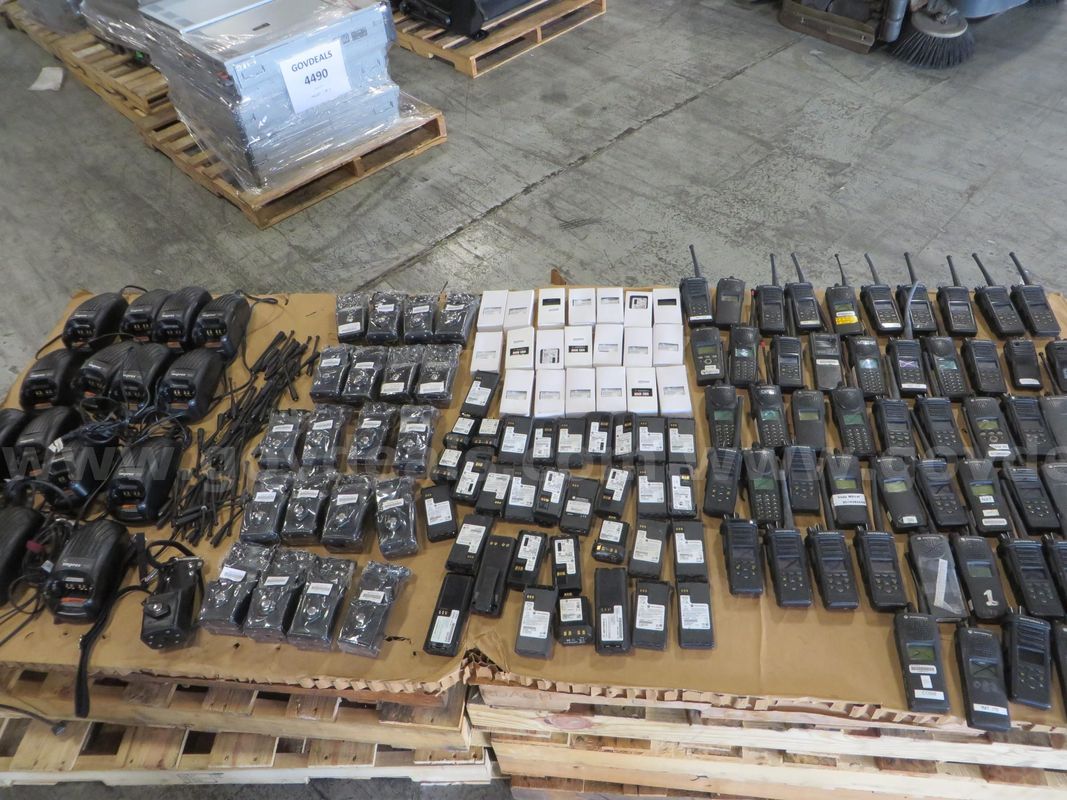 56 Hand-held radios and accessories (4 boxes)