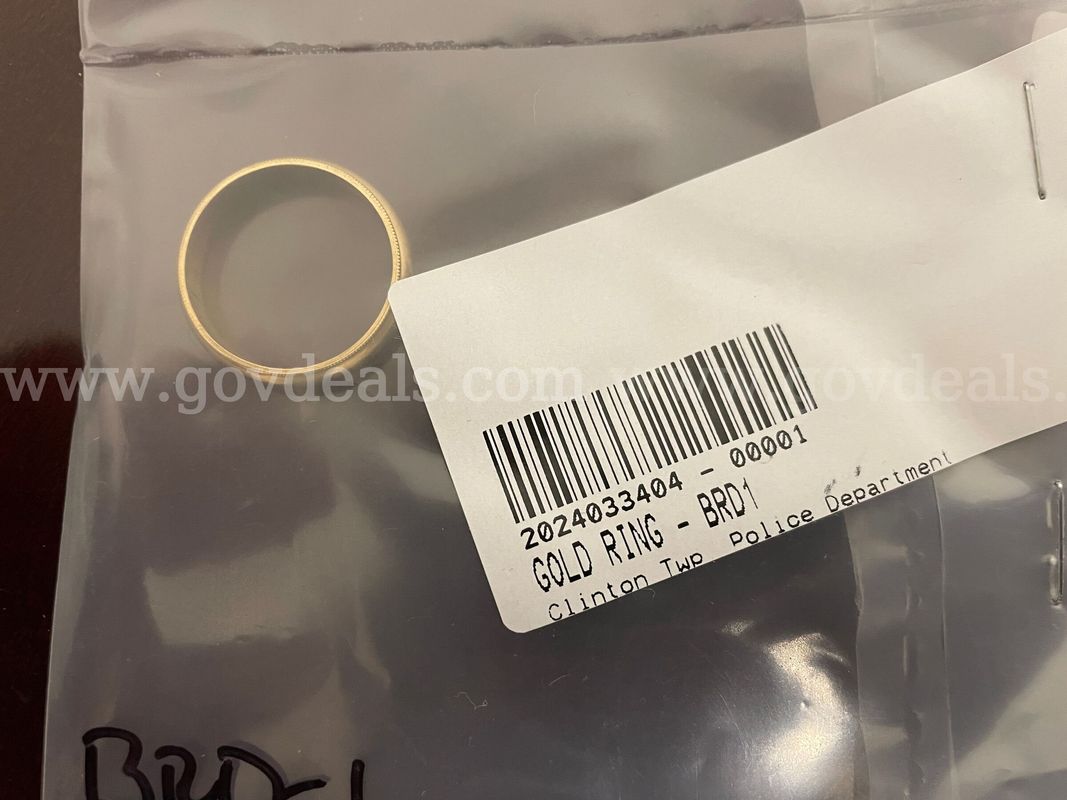 One (1) Gold Band Ring