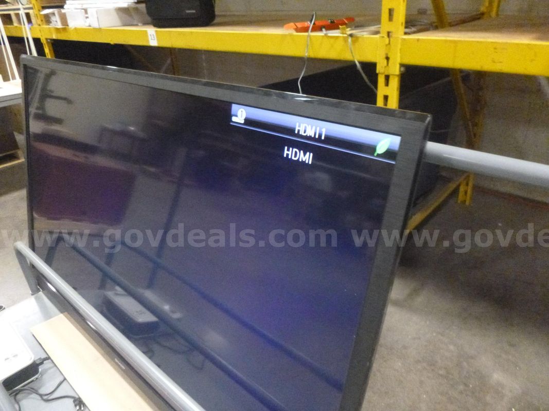 (1) 70" Sharp Liquid Crystal TV & (1) Toshiba LCD Projector