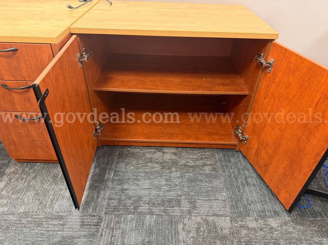 Cherry laminate two-door office storage cabinet with a single interior shelf