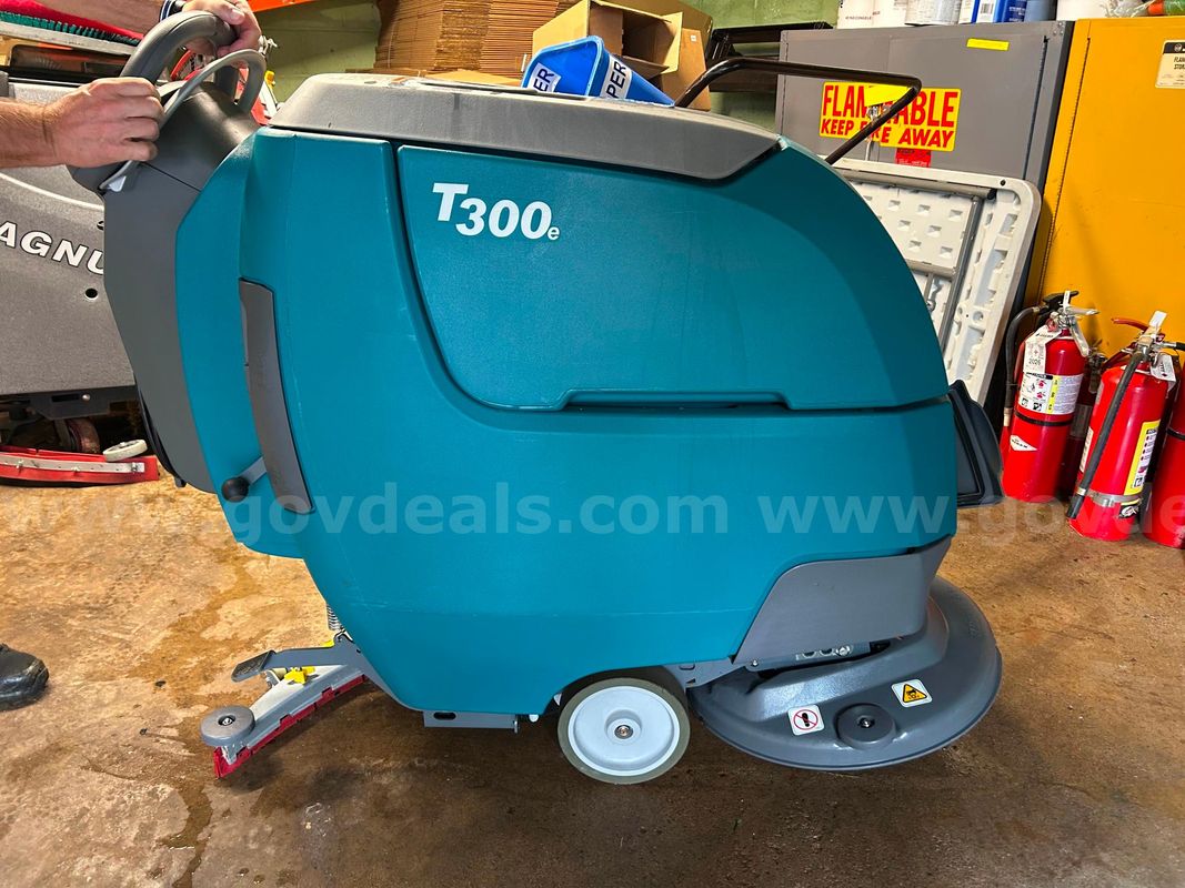 (1) Tennant T300 Walk Behind Floor Scrubber