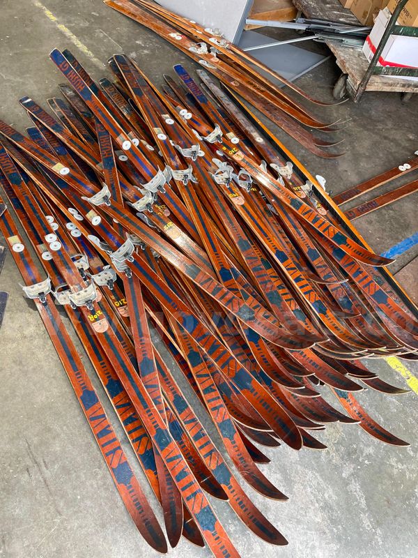 A collection of 50 plus antique wooden cross country skis.