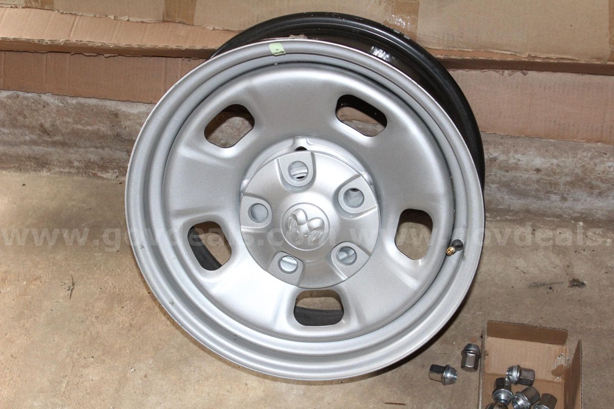 4 Dodge Ram 1500 wheels. Factory pull offs