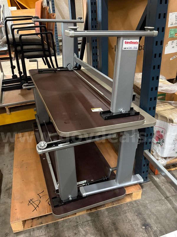 Get ready to work those biceps. Up for bid is a matching pair of Two Manual-Crank Standing Desks