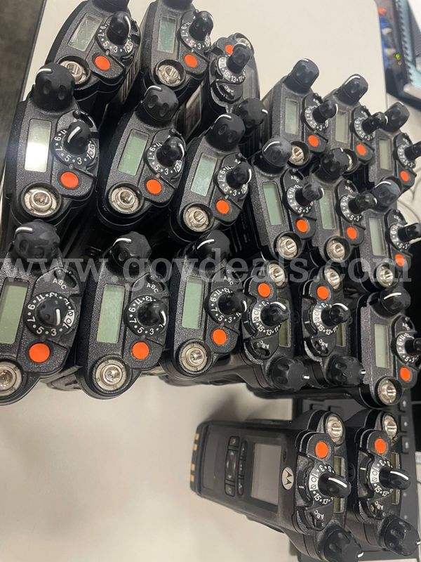 10 Motorola Poartable radio batch with accompanying antenna, charging base, and wire. Batch 3