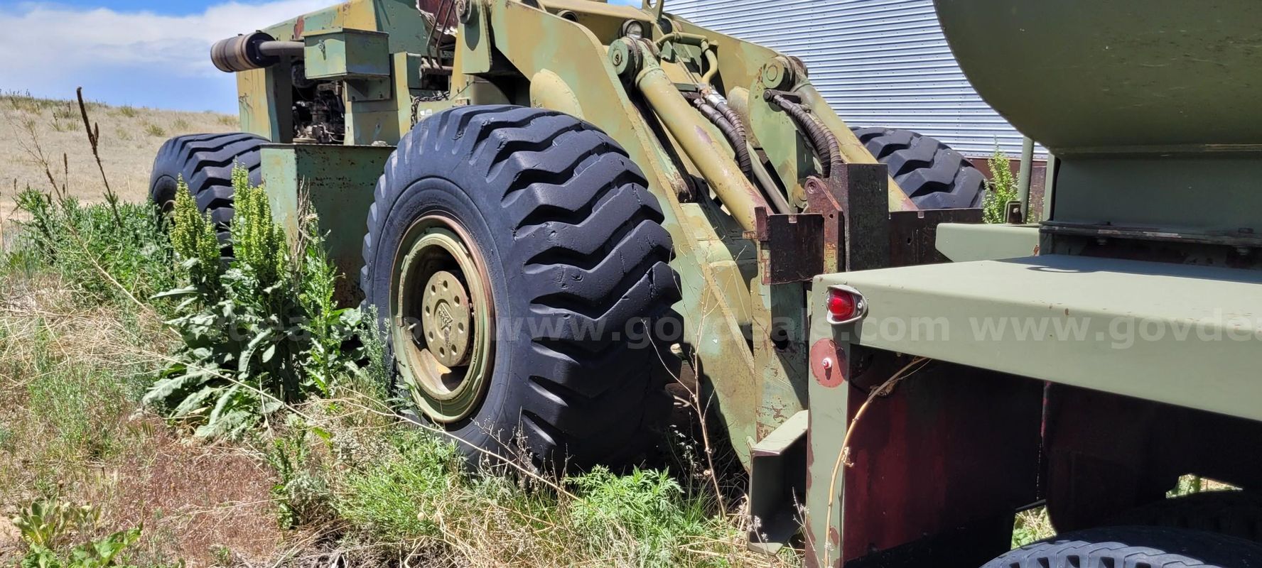 Trojan 3000M wheel loader with forks and bucket
