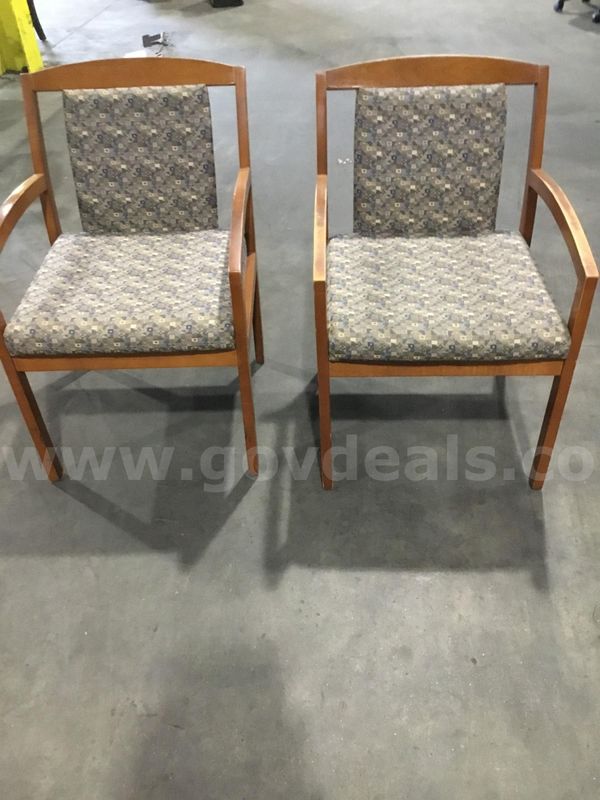 Two blue, tan striped standard chairs; with dark brown hardwood armrests "DH"