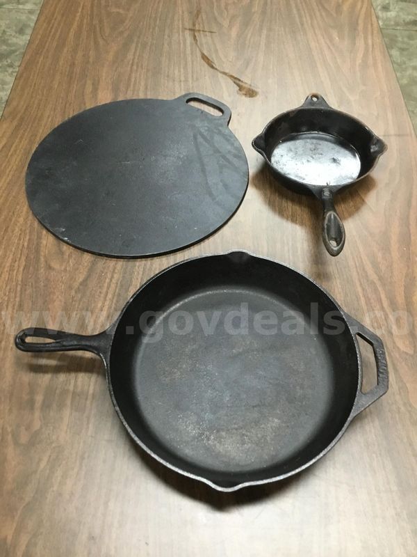 Lot of misc box items-12 inch black Lodge pan, an 8 inch pan, & a 16 1/2 inch black flat top "DH"