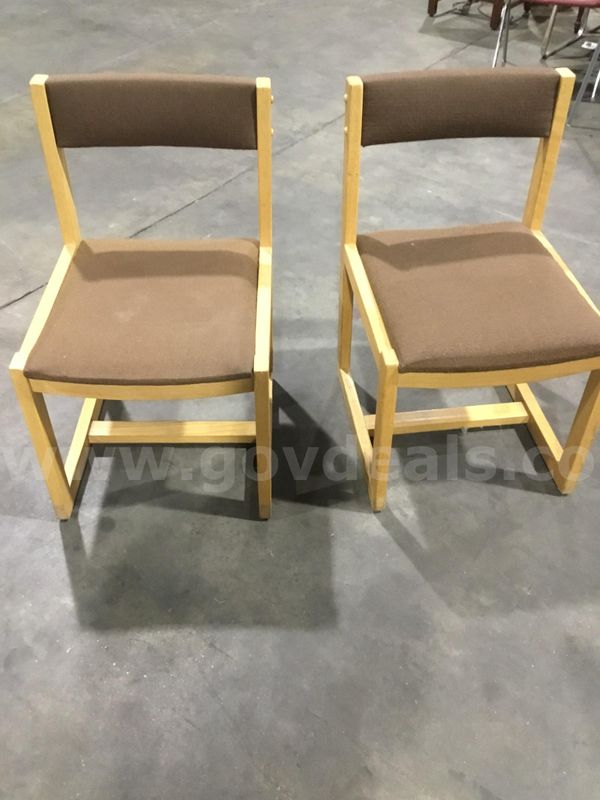 Two chocolate brown armless chairs; with light oak hardwood "DH"