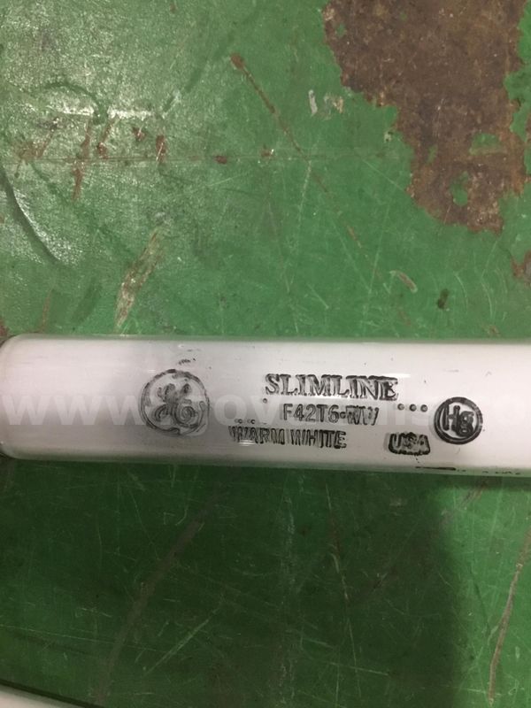 Two white 40 inch General Electric light place holders “DH”
