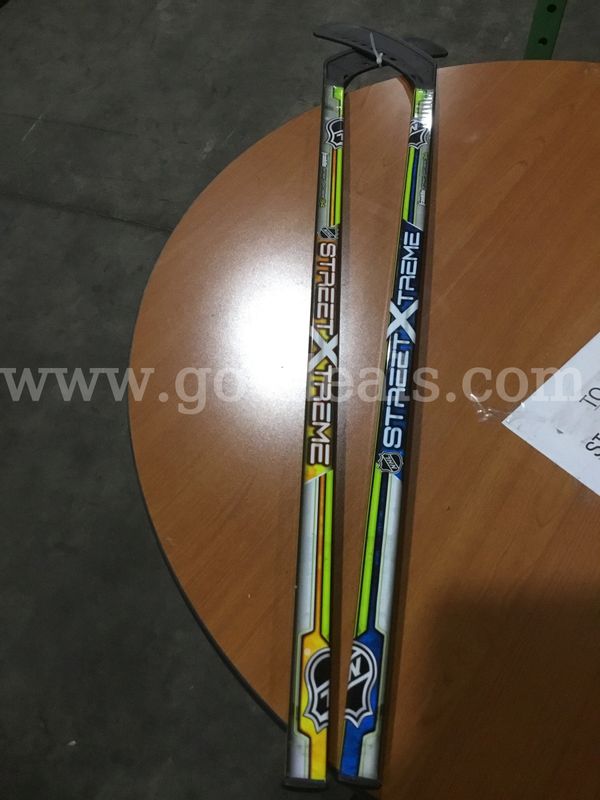 Two NHL extreme plastic hockey sticks; comes with a duffel bag “DH”