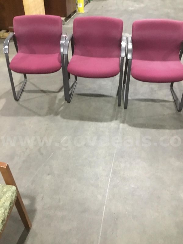3 burgundy sled chairs; with black padded armrests “DH”