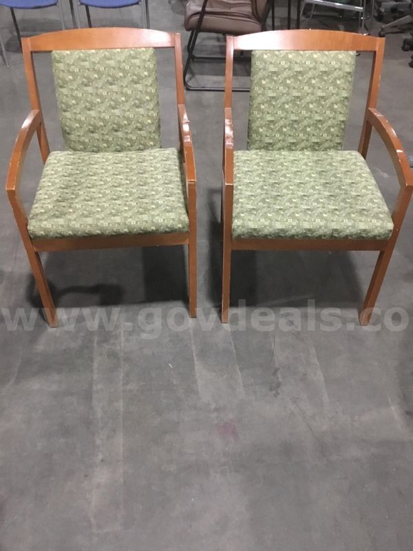 2 green chairs; with brown hardwood armrests “DH”