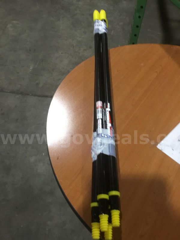 Four 38 inch black & yellow sticks "DH"