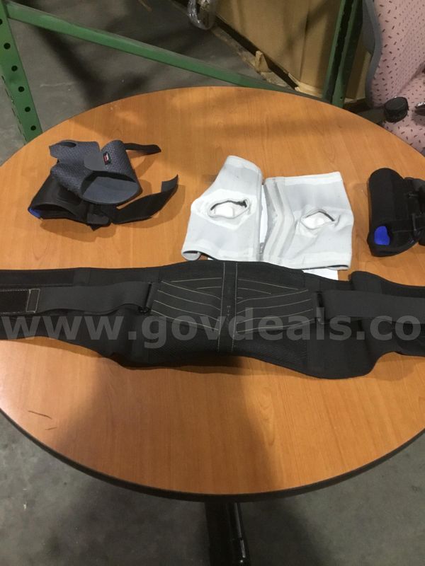 Lot of items-back brace, pair of gray & black knee protectors "DH"