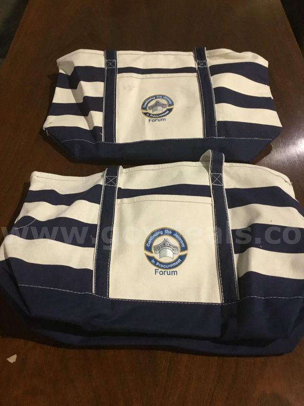 2 navy blue & white bags; with two note pads "DH"