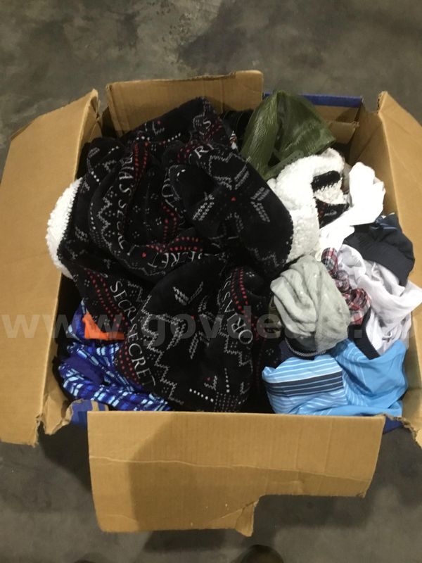 Box of clothes-shirts, hats, a rug "DH"