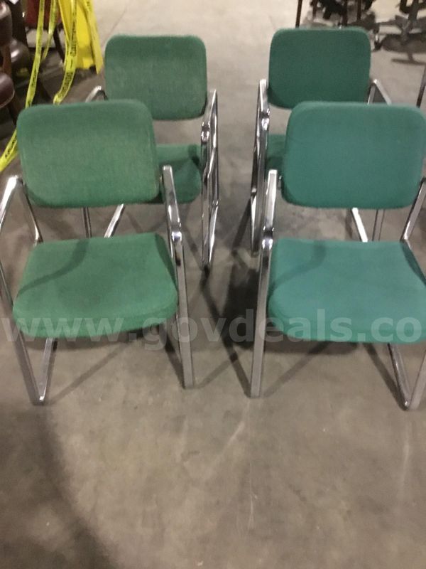 4 green sled chairs; with chrome silver armrests "DH"