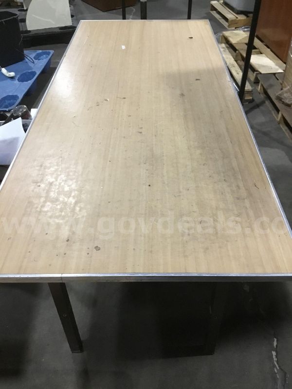 73 (LENGTH) x 30 (WIDTH) x 30 (HEIGHT) light brown rectangle table; with four chocolate brown steel leg stands "DH"