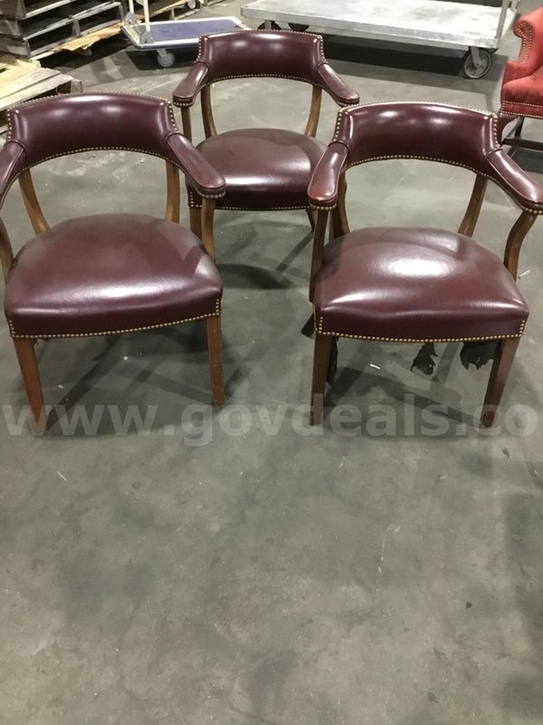 3 dark mahogany leather chairs; with matching mahogany armrests "DH"