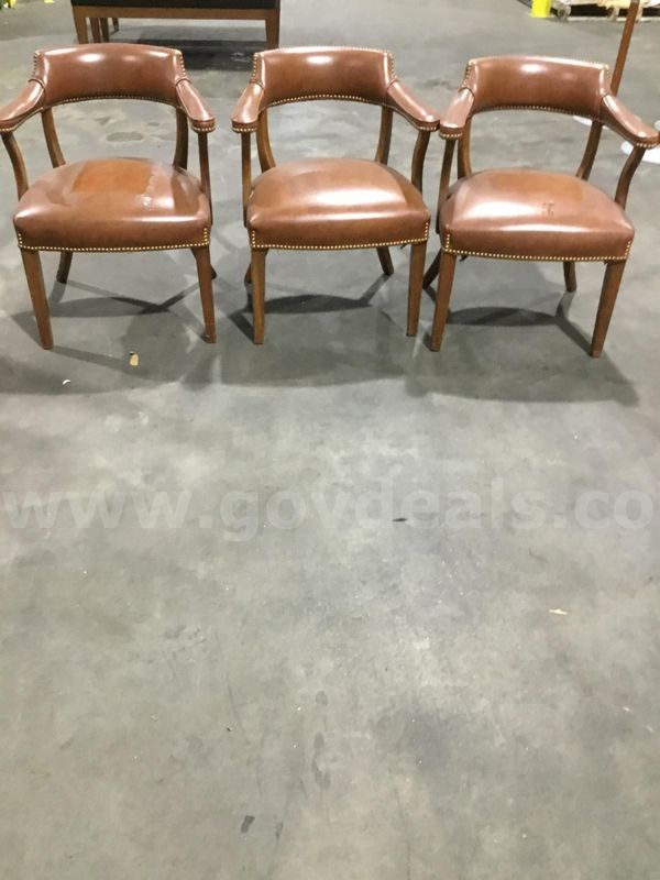 3 dark brown leather chairs; with matching brown armrests "DH"