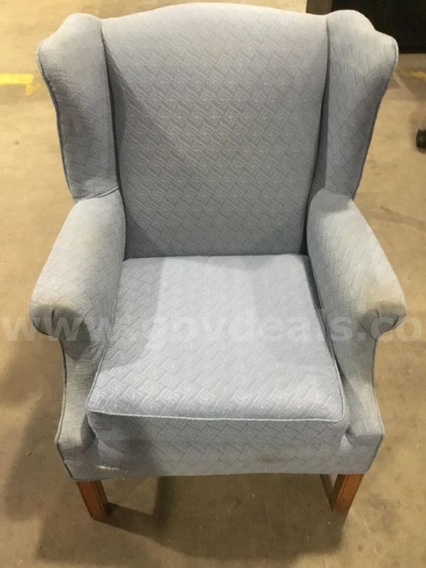 Sky blue executive chair; with matching blue armrests "DH"