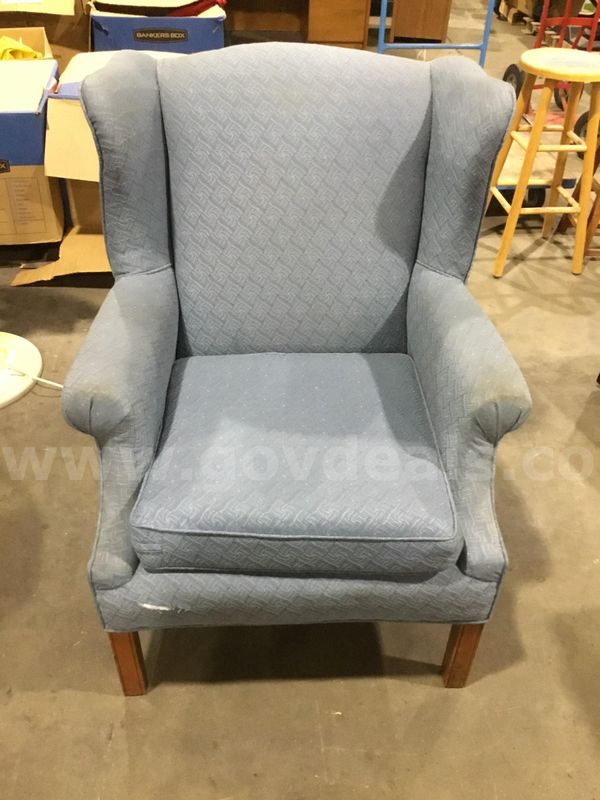 Sky blue executive chair; with matching sky blue armrests "DH"