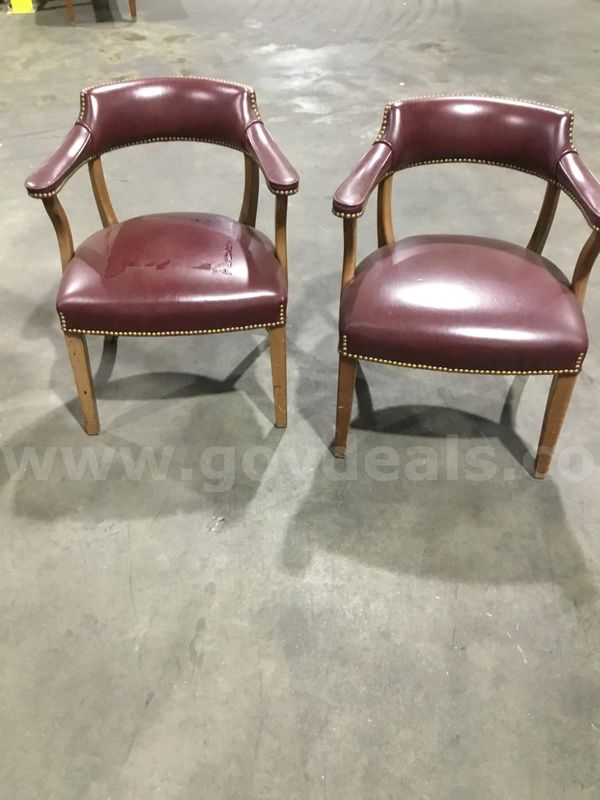 2 burgundy leather chairs; with burgundy matching armrests "DH"