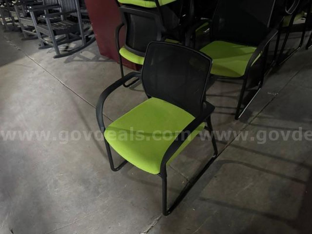 16 green stationary office chairs