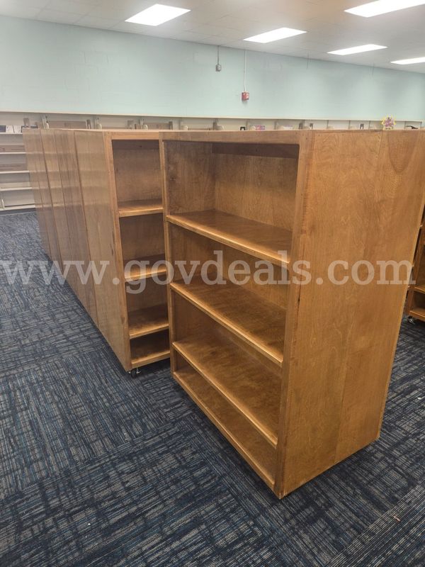 A lot of (6) Double-sided Roll Around Wooden Bookshelves