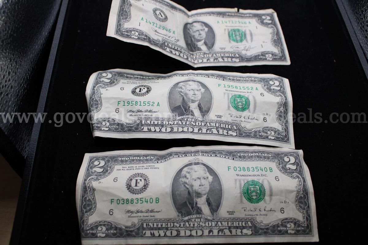 3 $2.00 Bills 19 Quarters 1 Half Dollar 1 $1.00 Coin 1 Foreign Coin