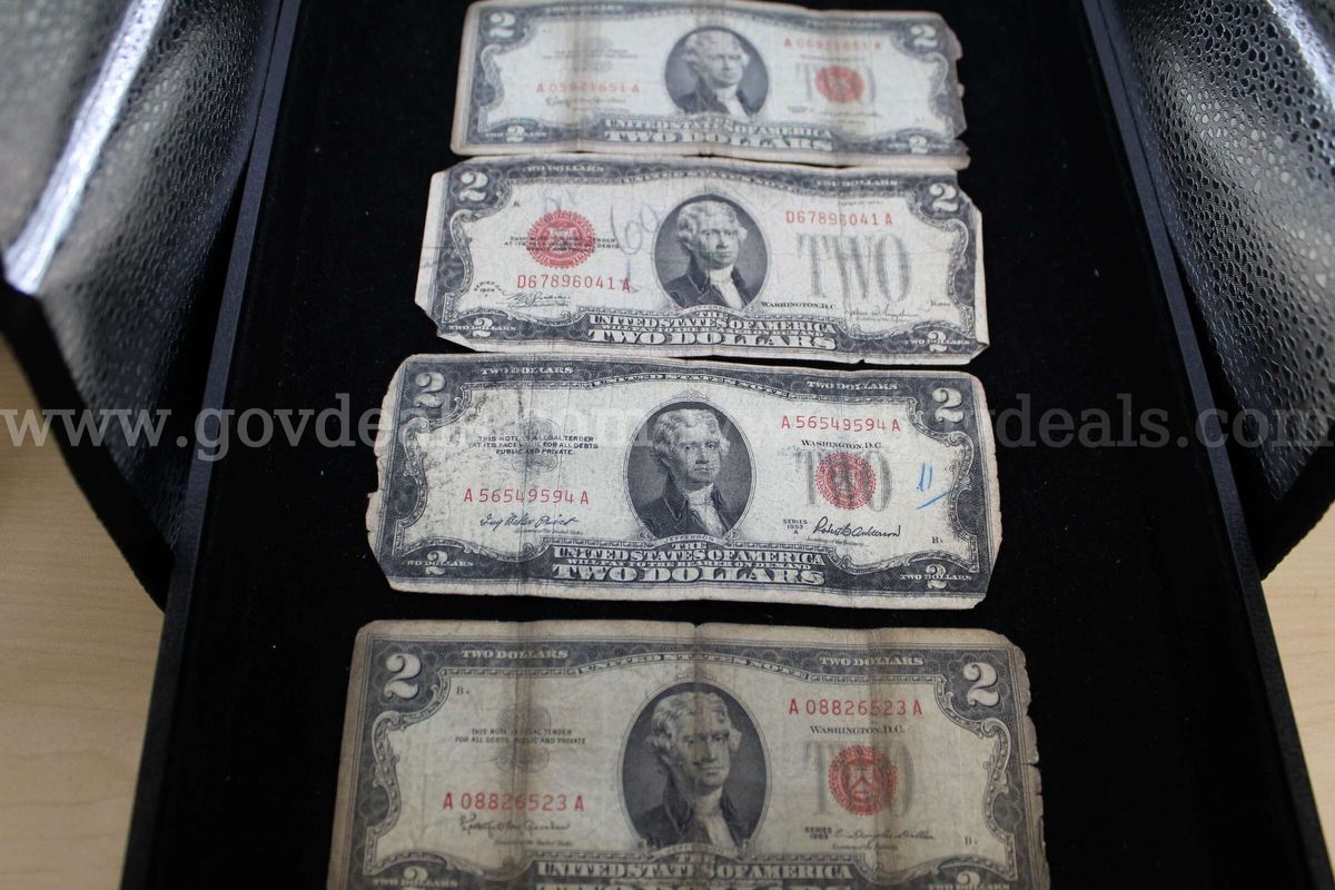 Half Dollars (8) 25 cent (10) Silver Dollars (7) Nickels (2) $2.00 Bill (4)