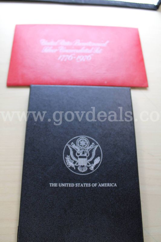 COIN SET (1); $1 COIN (1)