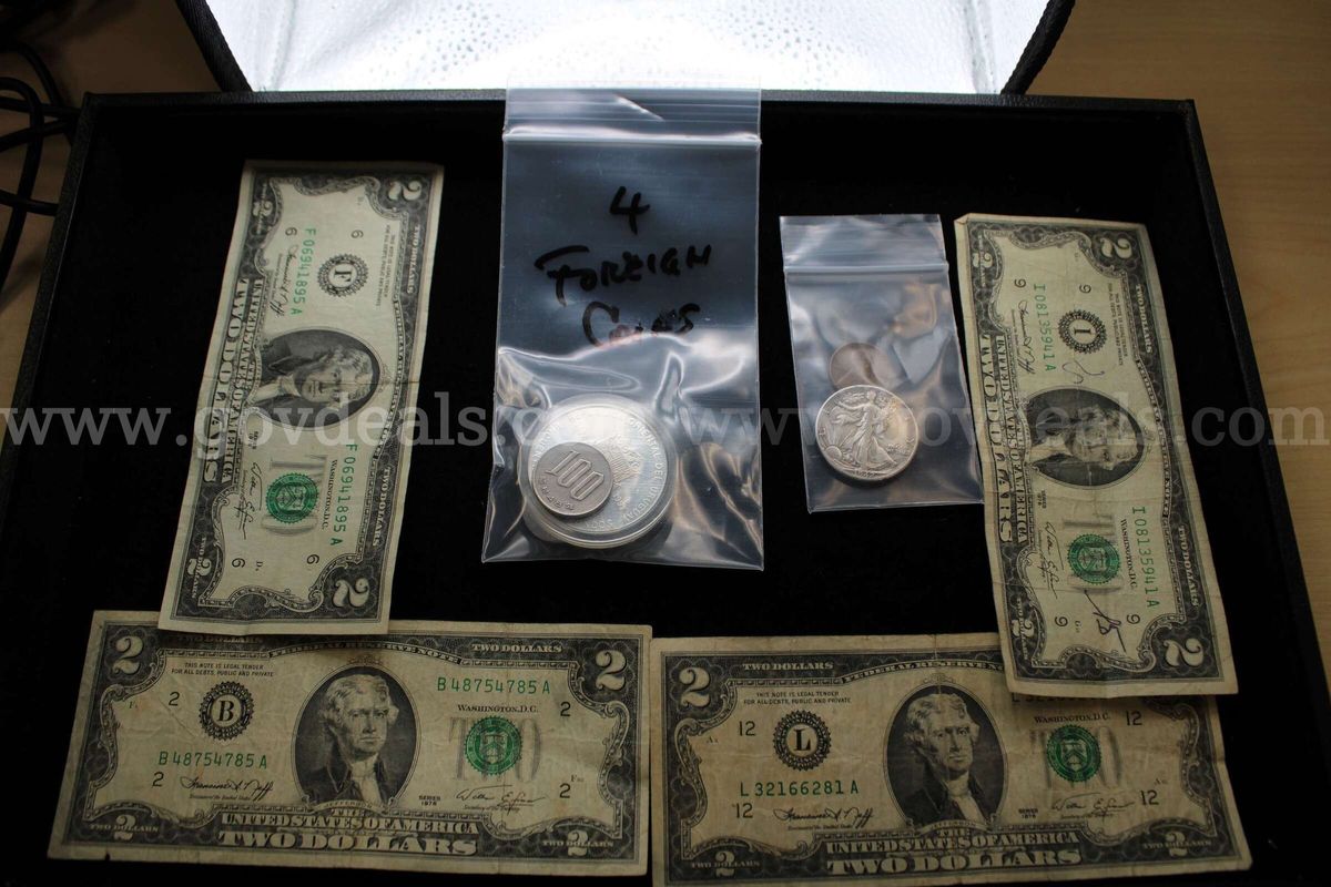 $2.00 Bill (4) Half Dollar (1) Penny (1) Foreign Coin (4)