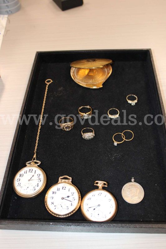 POCKET WATCH (3); RINGS (7); LOOSE STONE (1); CHARM WITH COIN (1); MIRROR (1)