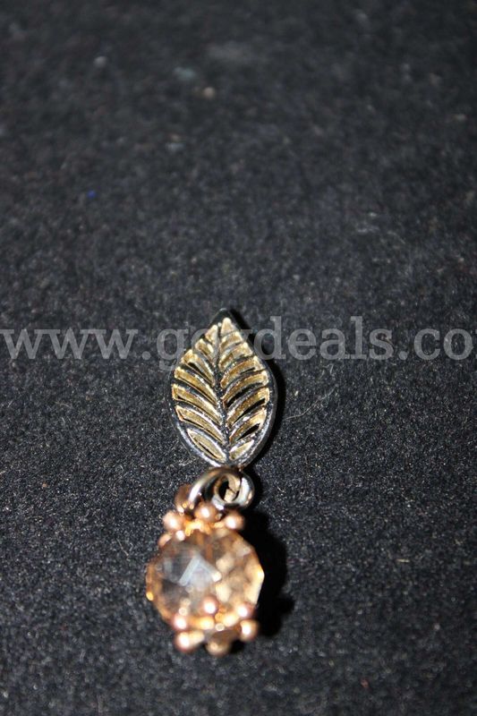 1 EARRING CYRSTAL LIKE YELLOW IN COLOR