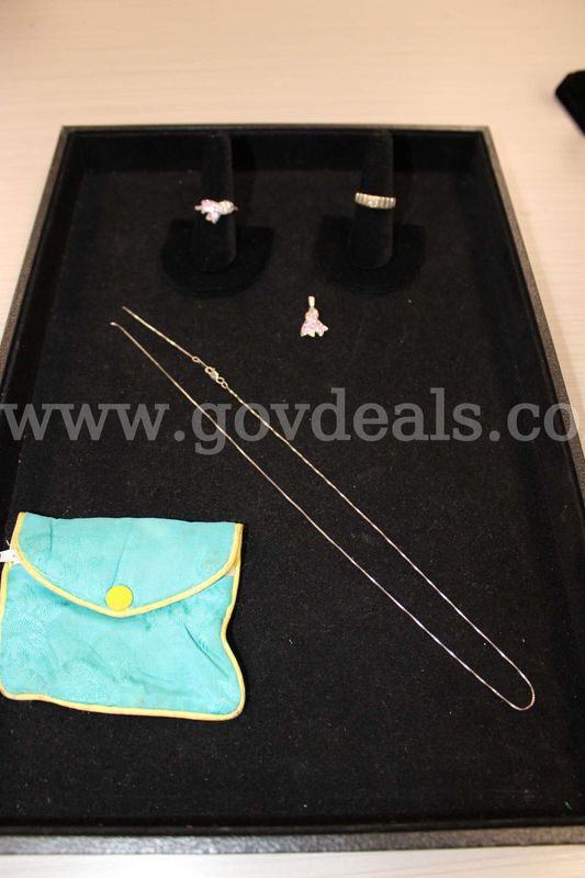 Necklace (1) Charm (1) Ring (2) Pouch (1)