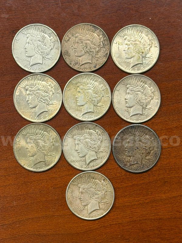 Lot of 10 U.S. Silver Peace Dollars (1922, 1935, 1925, 1923, 1925, 1922, 1923, 1924, 1926, 1923)