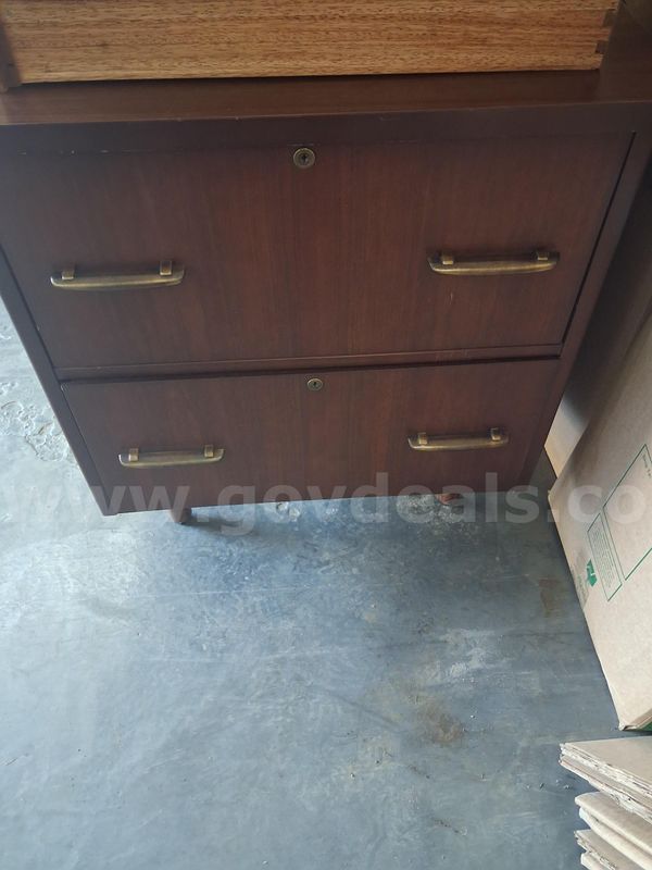Wood desk and two drawer filing cabinet.