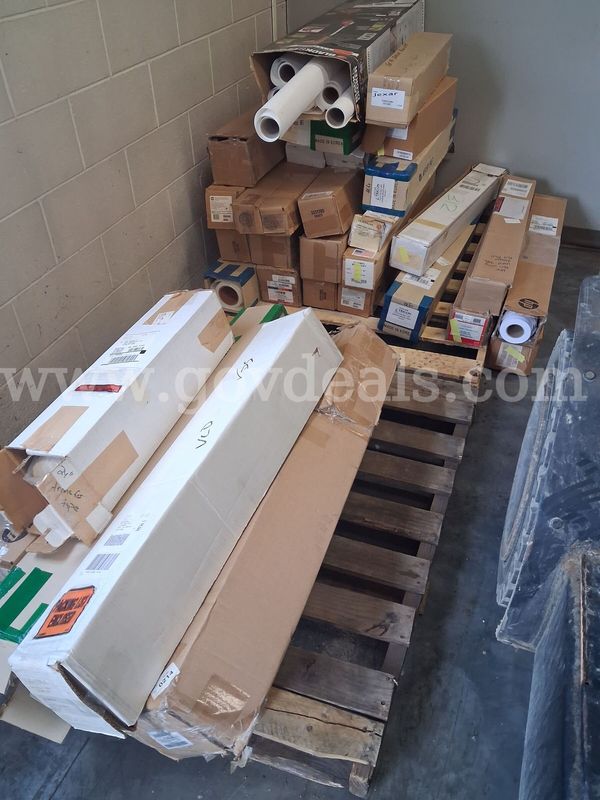 Lot of large printer paper rolls.