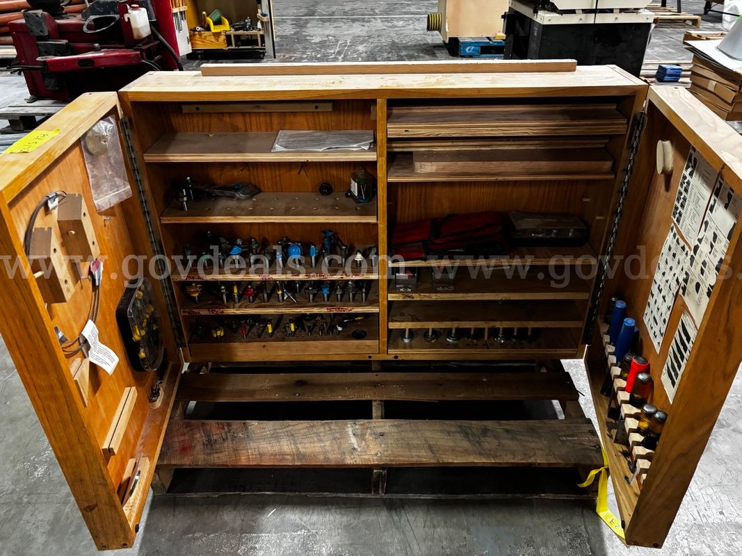 Woodworking Cabinet With Router Bits and Chisels