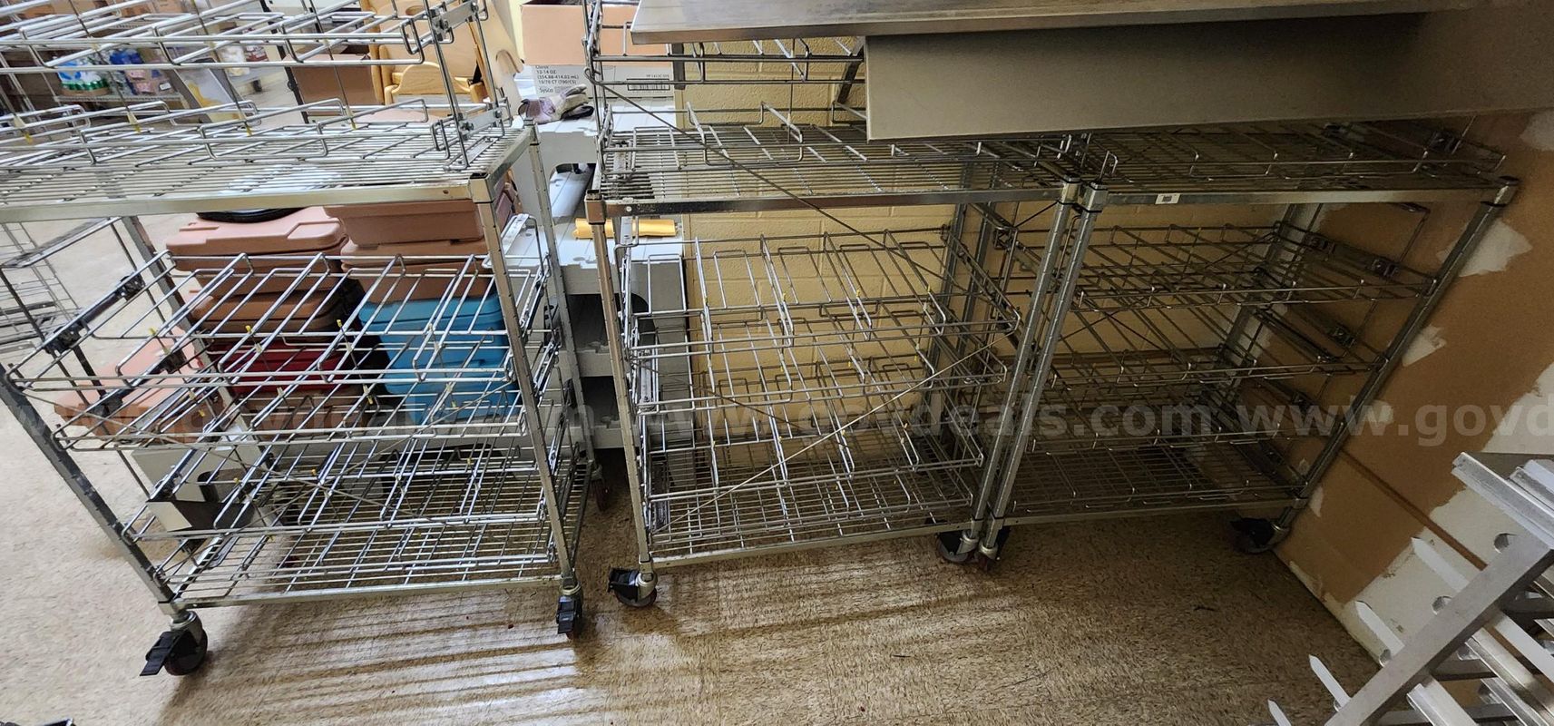 Lot of (6) Rolling Commercial Can Holder Rack