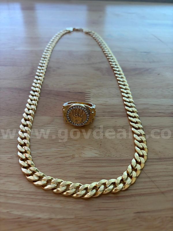 TiDDRs: 24" / 9mm Chain and Ring Size 11.75, featuring a crown and multiple clear stones. NOT solid gold. Gold plated.